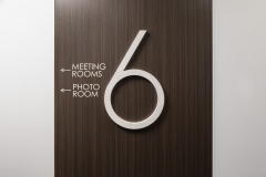 Vivid House Number | Custom Commercial Sign | Number 6 with meeting rooms and photo room signs on a brown wooden wall | Brushed  Aluminum White Finish
