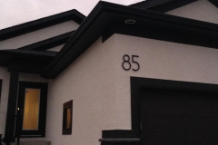 Residential House Numbers | Material: 3/8" aluminum | Finish: Black paint | Font: TimeBurner | Size: 12" | Substrate: Stucco