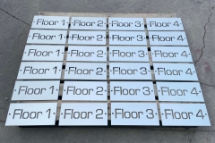 Vivid House Numbers | Custom Commercial Floor Number | Brushed Aluminum Finish on a pallet