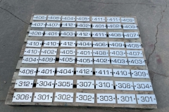 Vivid House Numbers | Custom Commercial Floor Number | Brushed Aluminum Finish on a pallet