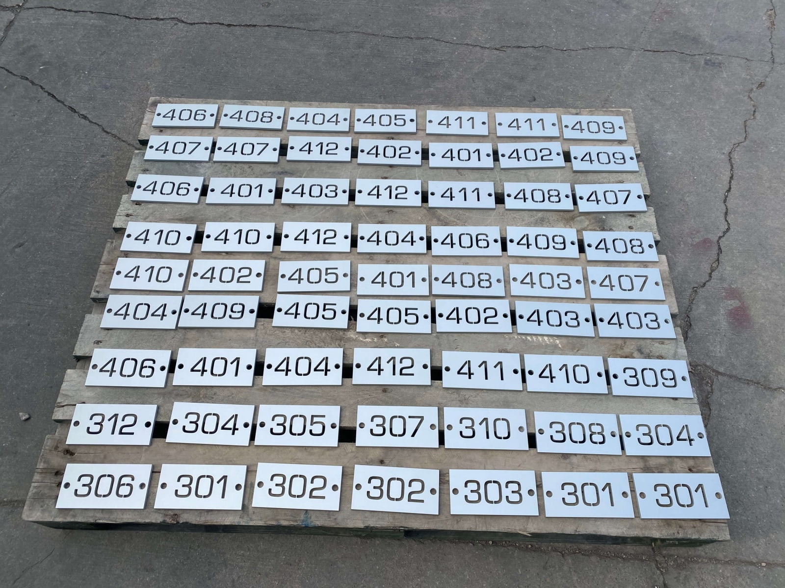 Vivid House Numbers | Custom Commercial Floor Number | Brushed Aluminum Finish on a pallet