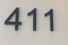 Vivid House Number | Residential House Sign | Number 411 | Black Finish | LED Backlight | Whitewall in front of a house